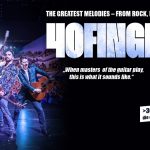 Vier Gitarrenspieler auf der Bühne